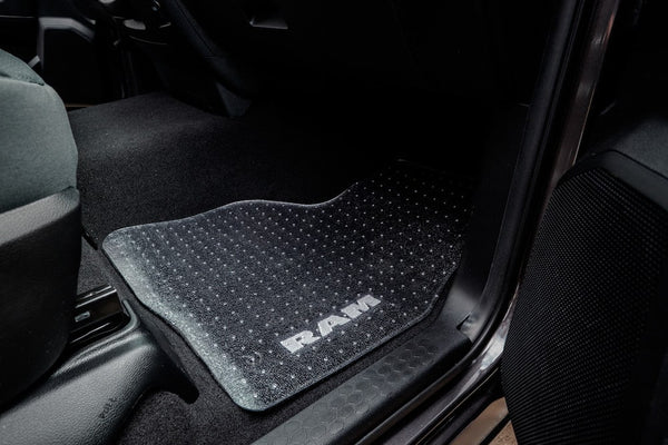 Clear ExactMat placed on top of front passenger mat. Highlight