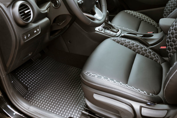 X-Mat shown on dirver side floor of vehicle. Highlight