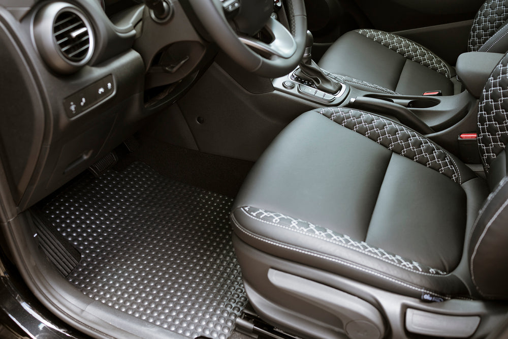 X-Mat shown on dirver side floor of vehicle. Highlight